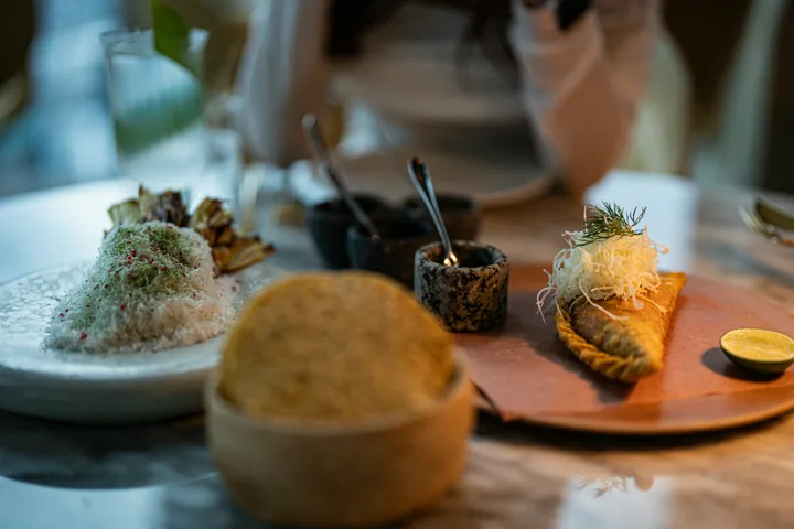 Two carefully plated dishes served on a restaurant table