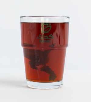 Black tea with glass cup - شاي أسود في كوب زجاجي